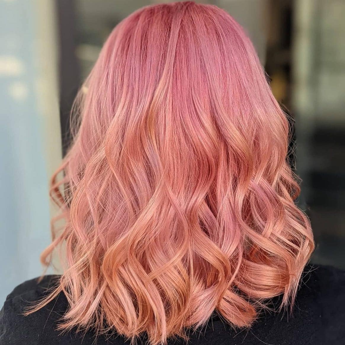 16. Peach-Infused Rose Gold Curls - Rose Gold Hair Color