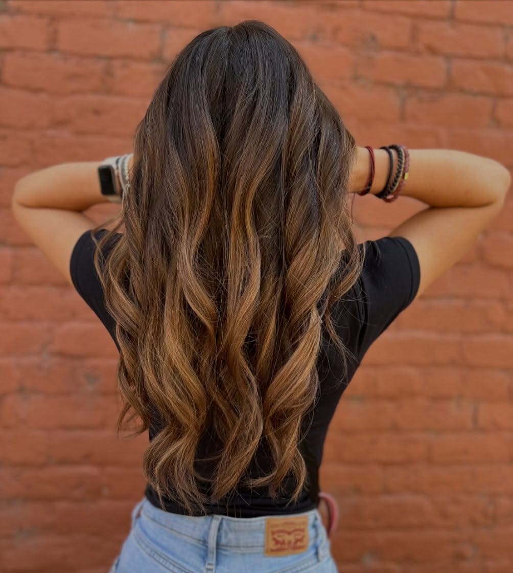 10. Caramel-Infused Brunette Waves - Brown Hair Color