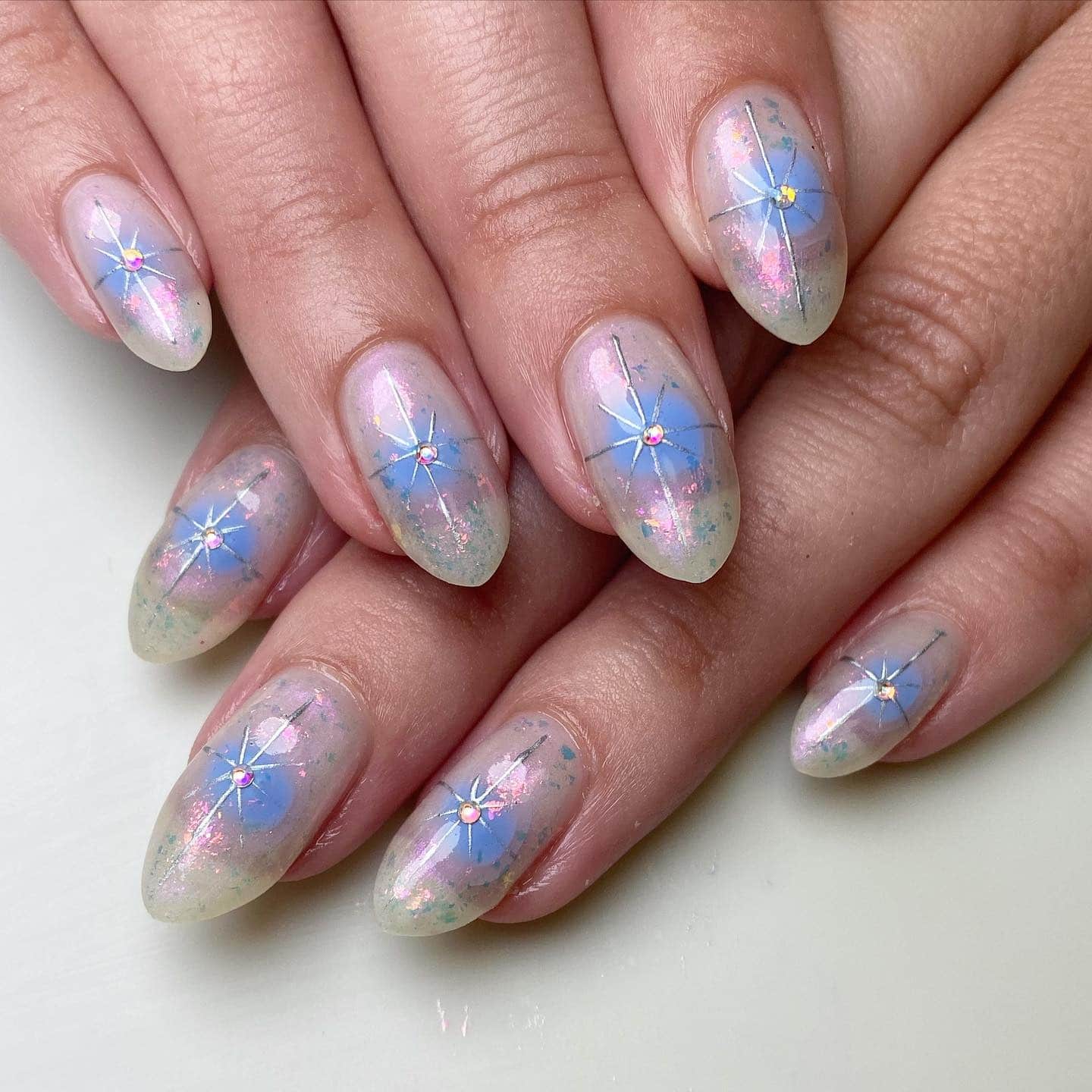 7. Ethereal Starburst Periwinkle Shimmer - periwinkle nail ideas