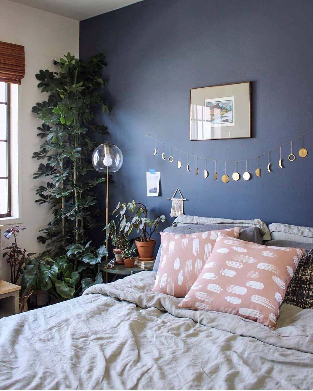 1. Botanical Calm with Indigo Walls - blue wall bedroom ideas