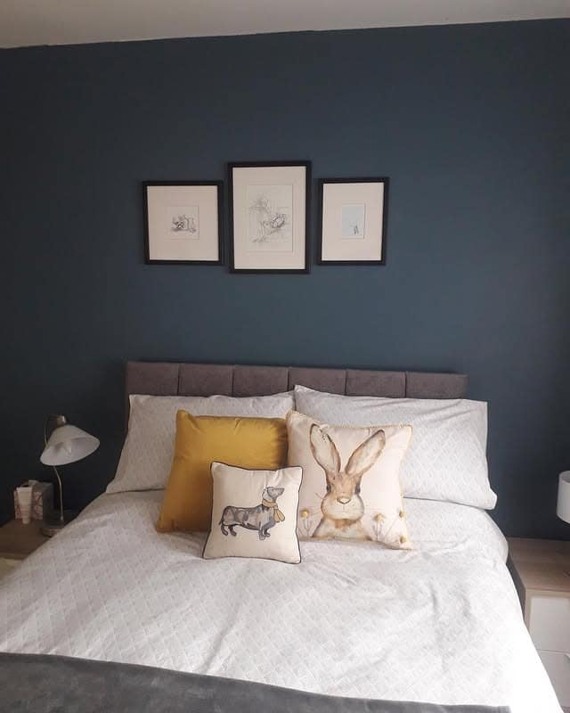 3. Playful Modern Blue Retreat - blue wall bedroom ideas