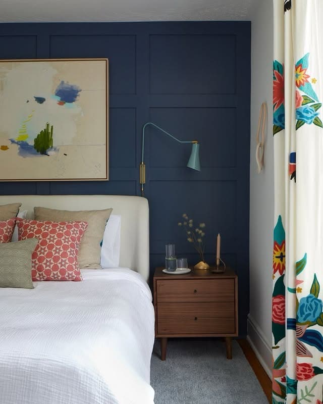 11. Modern Navy Accent with Retro Charm - blue wall bedroom ideas