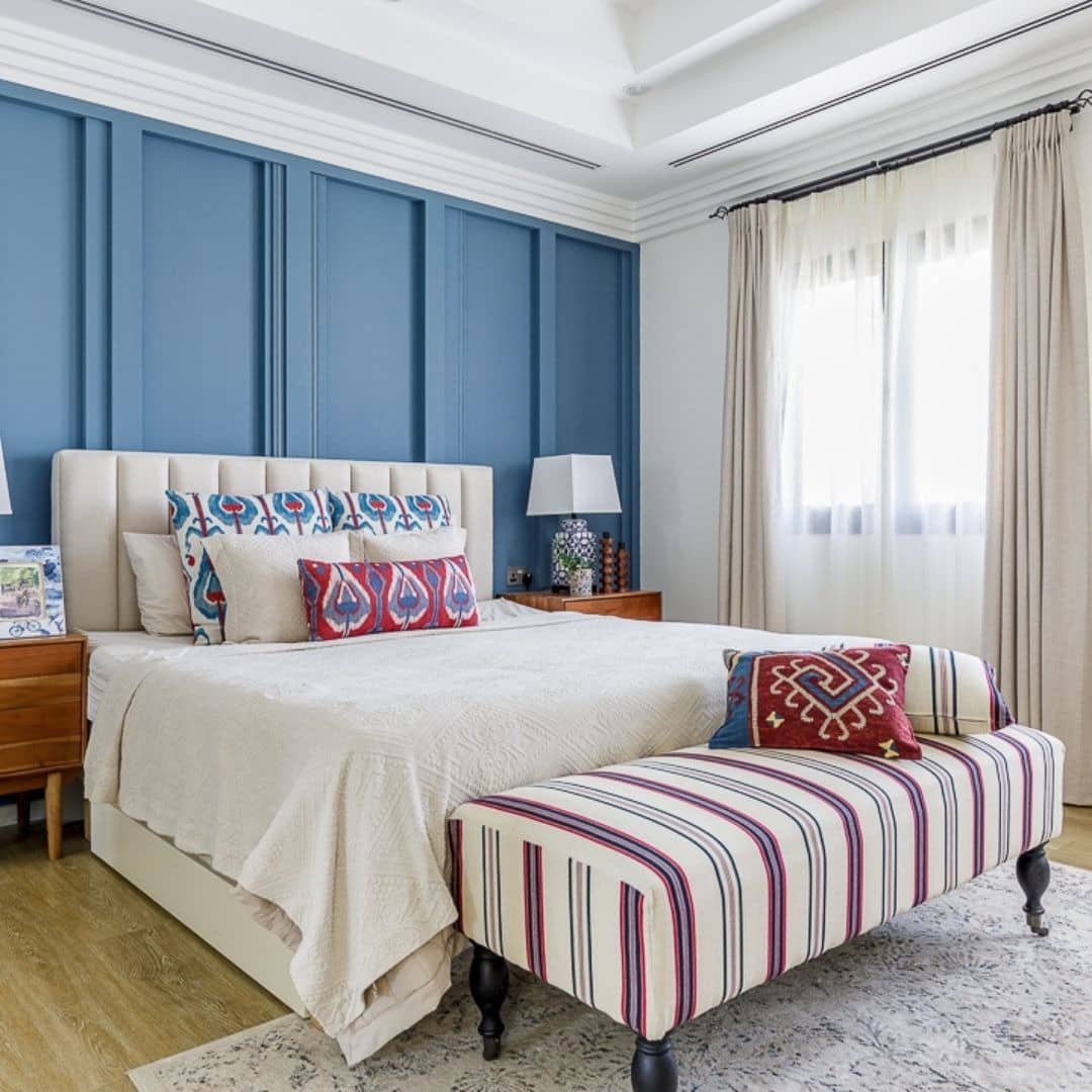 17. Classic Blue Elegance with Patterned Layers - blue wall bedroom ideas