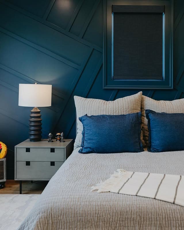 22. Modern Depth with Navy Geometry - blue wall bedroom ideas