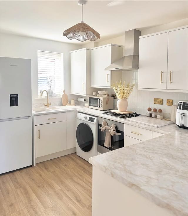 5. Soft White Kitchen with Modern Elegance - small white kitchen ideas