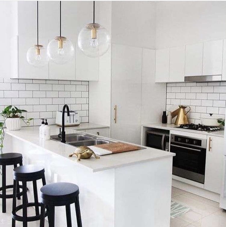 15. Modern White Kitchen with Black Accents - small white kitchen ideas