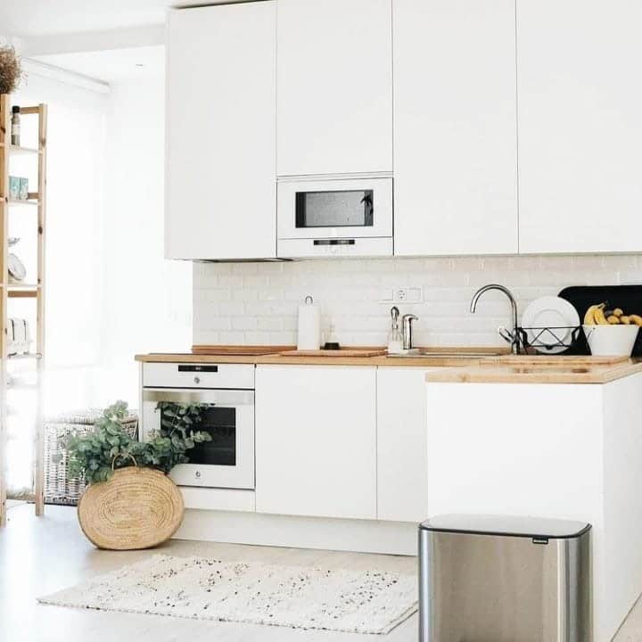 17. Bright White Kitchen with Scandinavian Simplicity - small white kitchen ideas