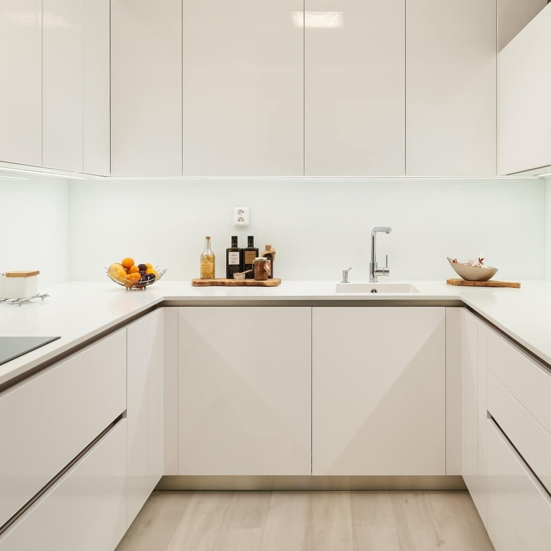 21. All-White Modern Kitchen with Sleek Minimalism - small white kitchen ideas