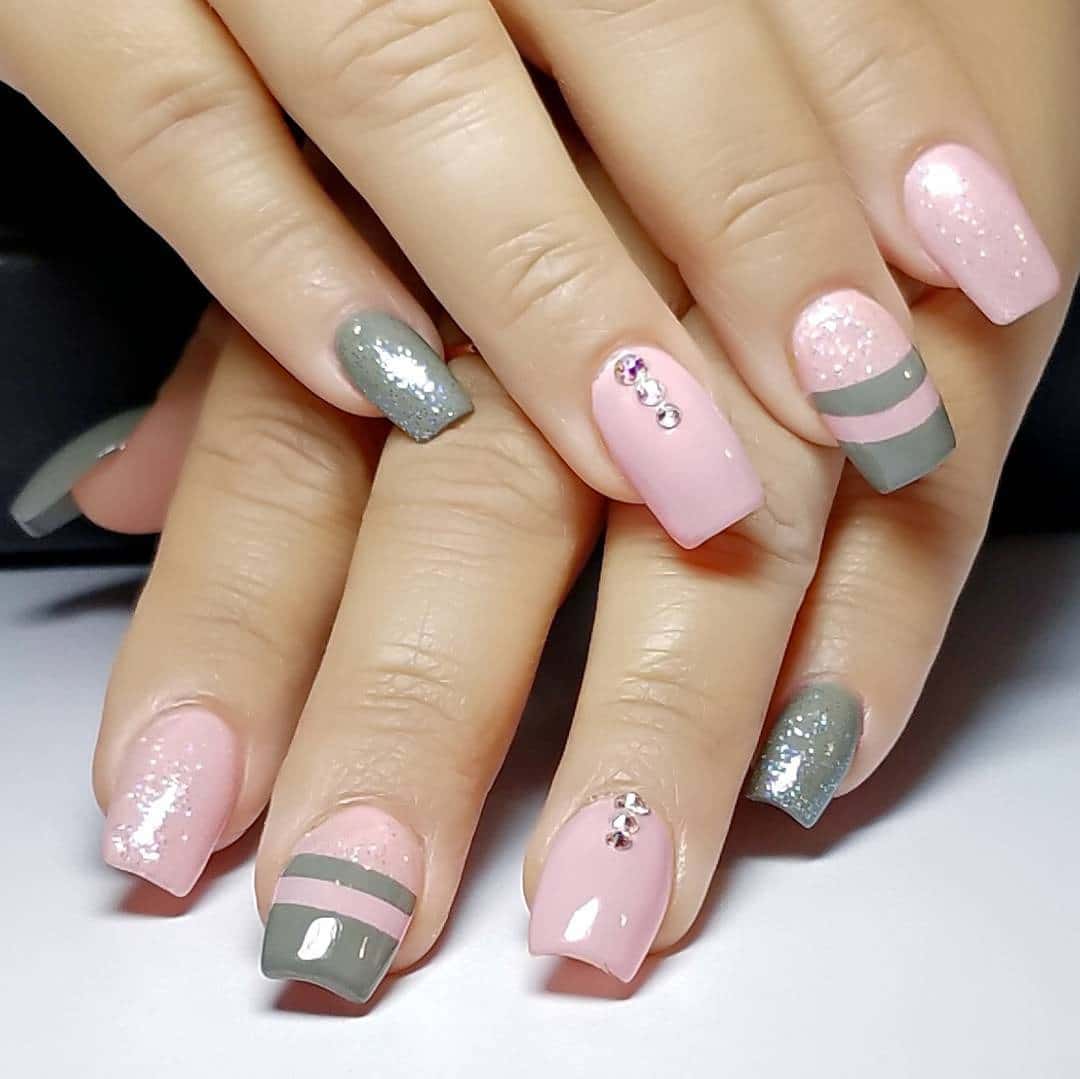 16. Striped Pastel Elegance - pink and gray nail ideas