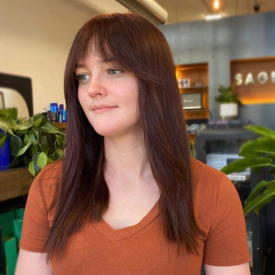 8. Cherry-Infused Brown with Fringe - Chocolate Brown Hair Color