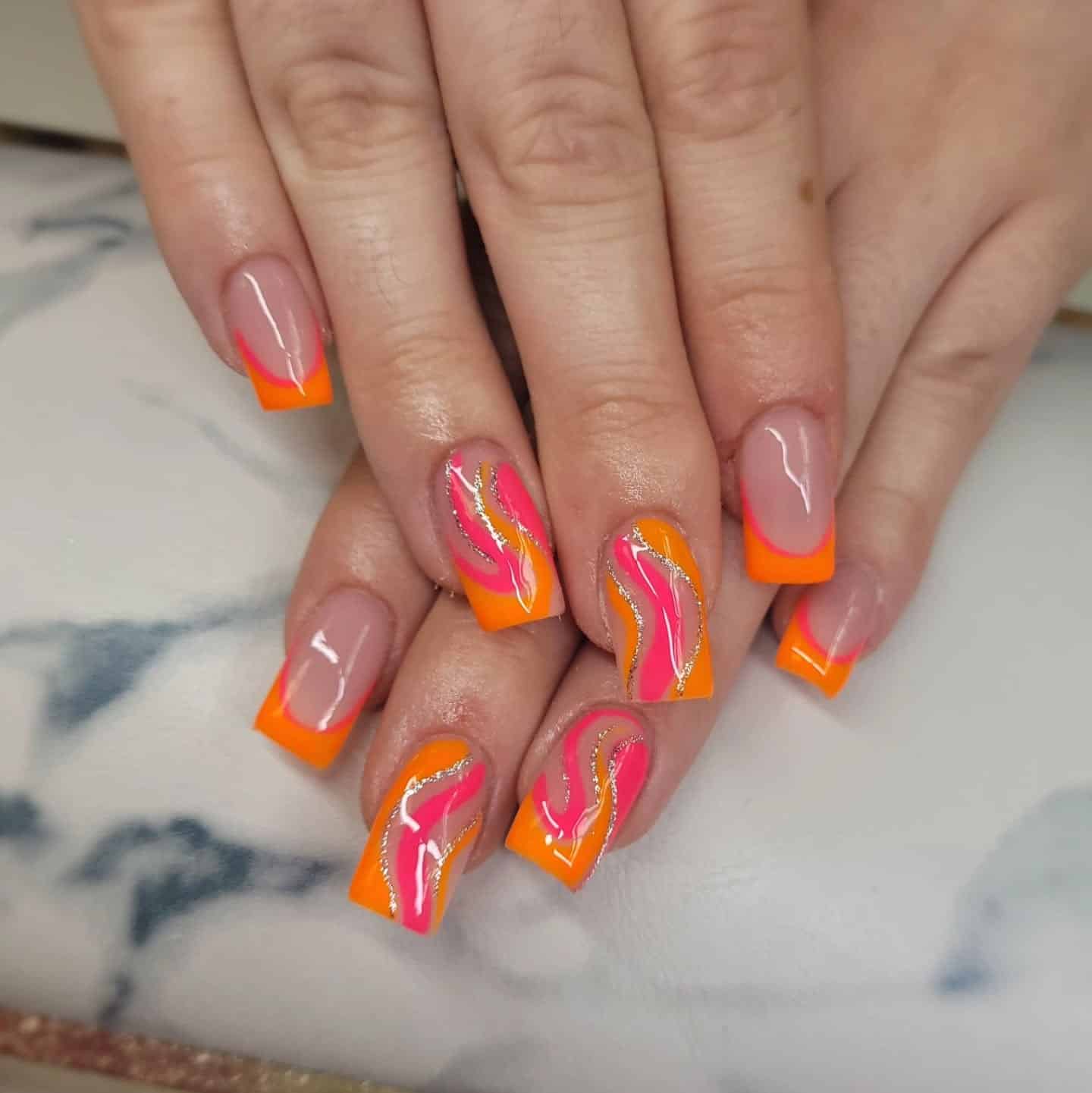 2. Neon Fusion French Tips with Swirls - pink and orange nail ideas