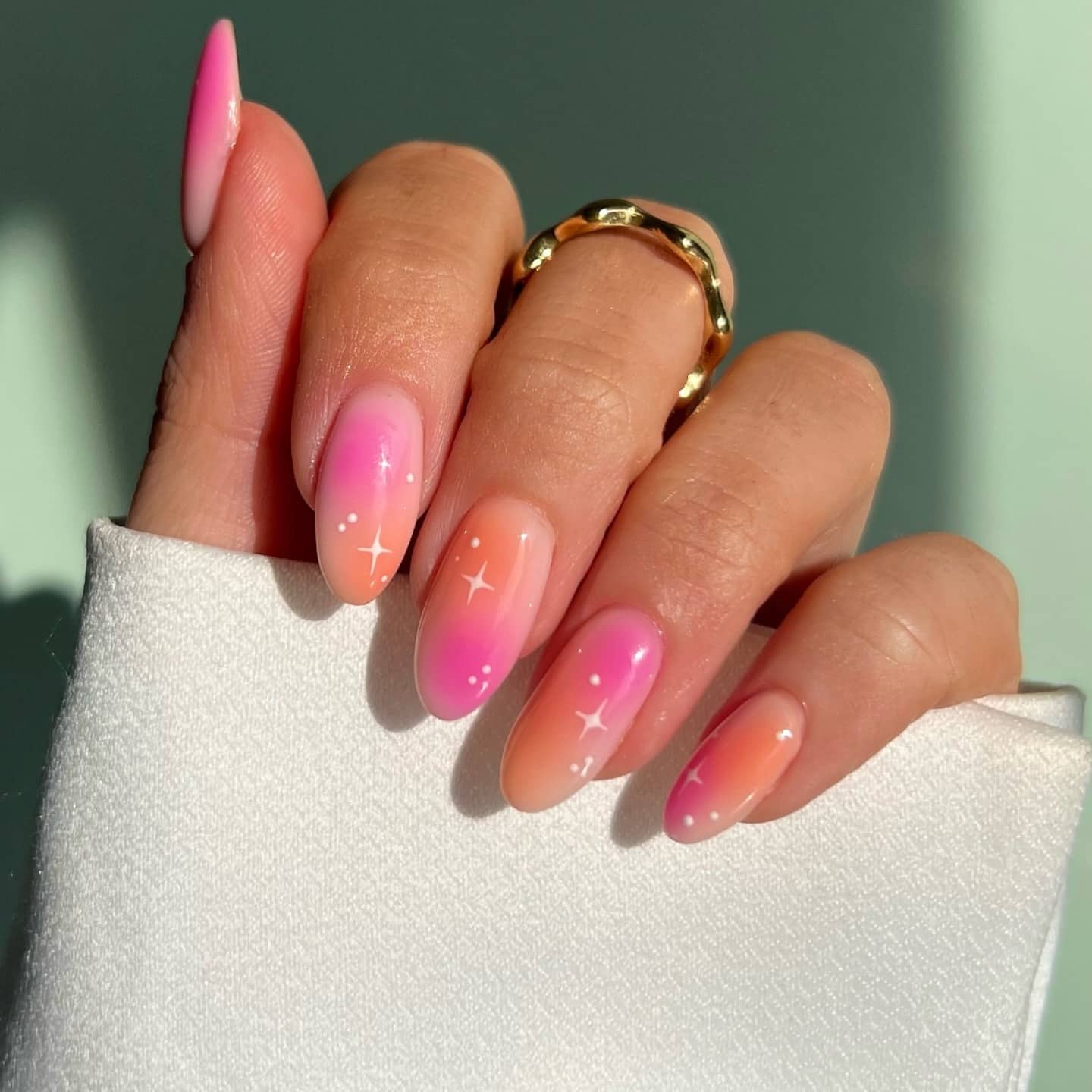 21. Peach Glow Ombre Nails with Star Accents - pink and orange nail ideas