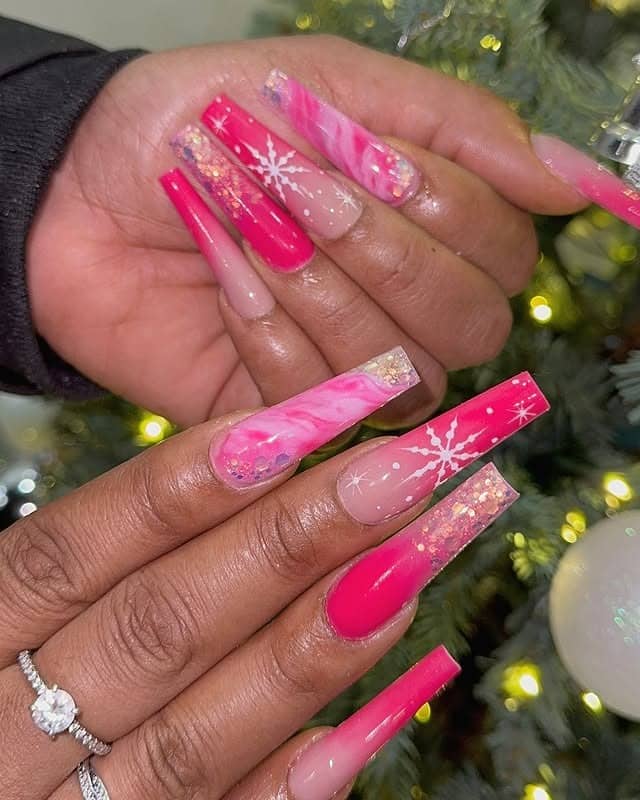6. Fuchsia Marble Snowflake Nails - pink christmas nail ideas