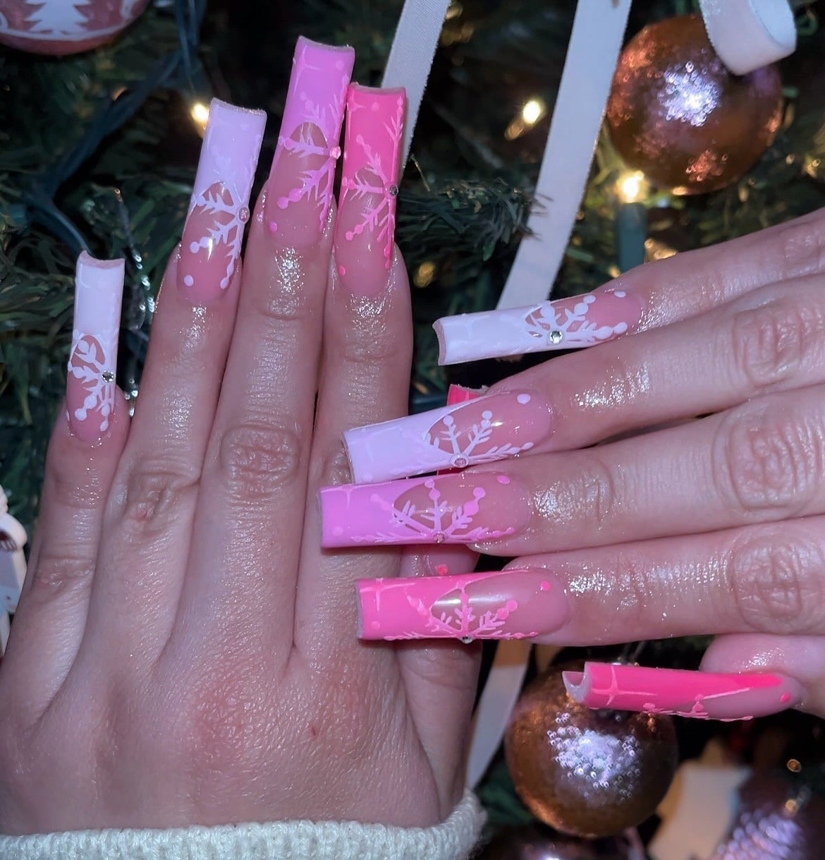 22. Gradient Pink Snowflake Coffin Nails - pink christmas nail ideas
