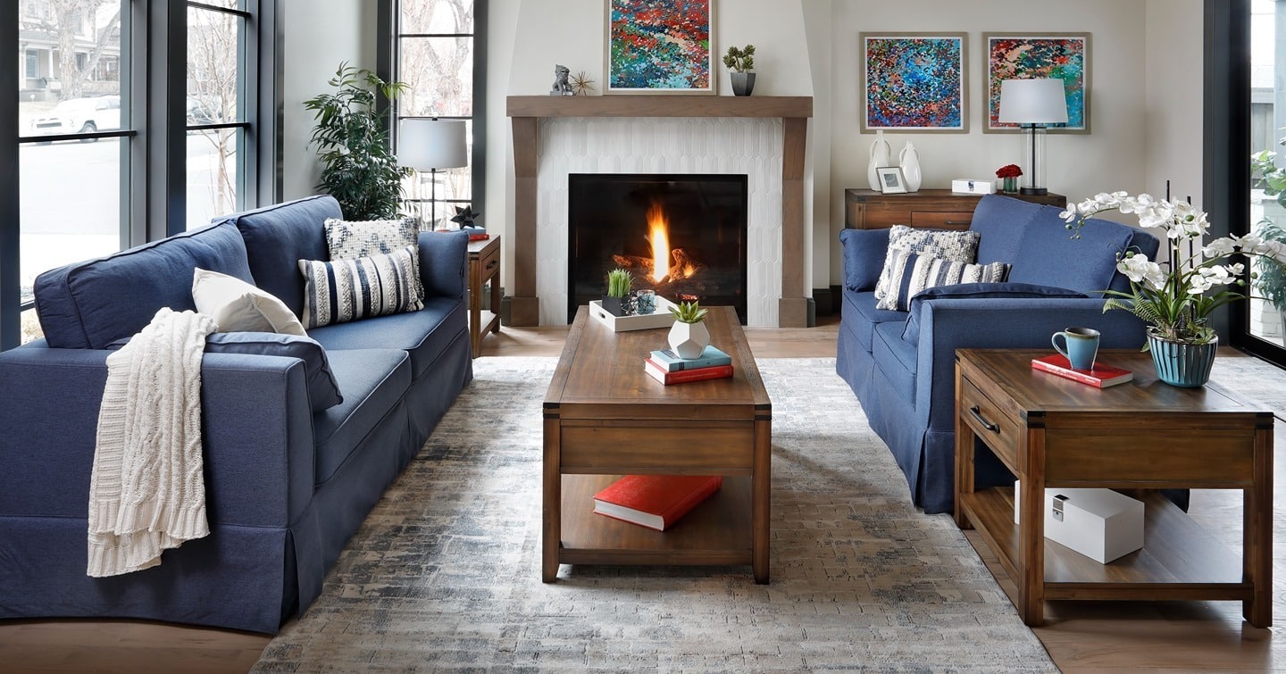 5. Cozy Fireplace Gathering in Blue and Wood - gray and blue living room ideas