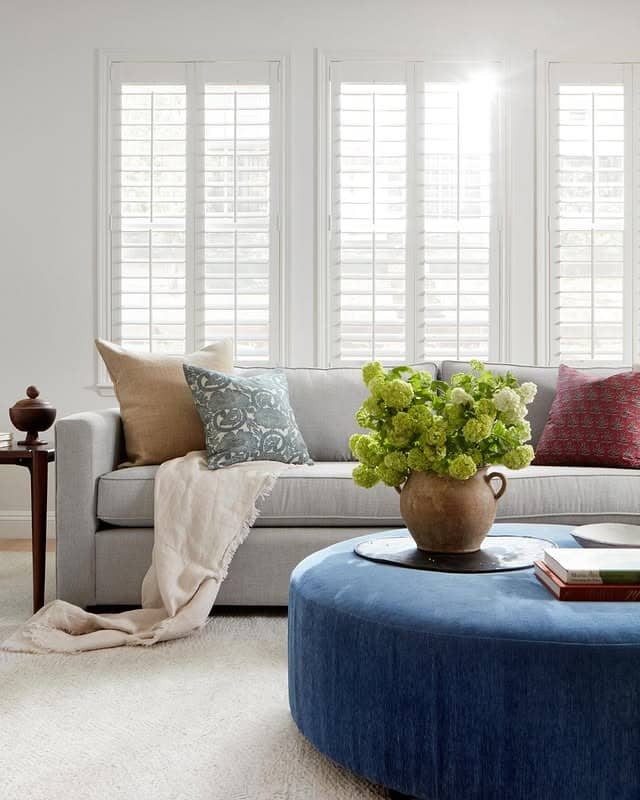 11. Soft Gray Comfort with Blue Ottoman Accent - gray and blue living room ideas