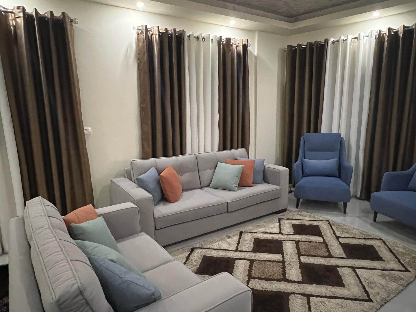 12. Contemporary Balance in Gray and Muted Blue - gray and blue living room ideas