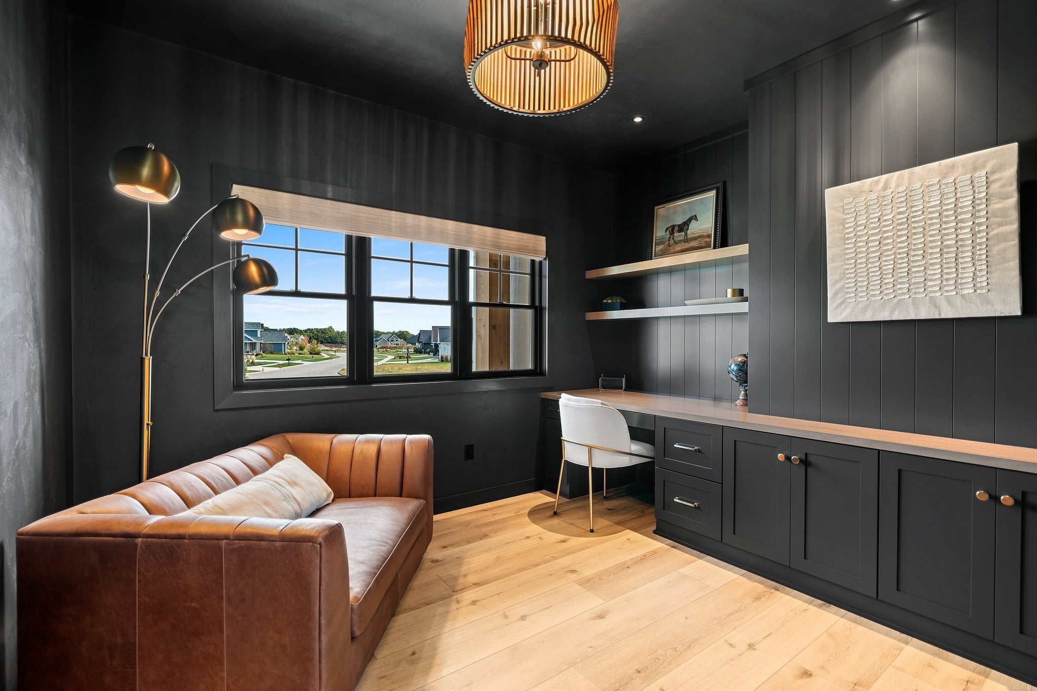 6. Charcoal and Cognac Retreat - dark home office ideas