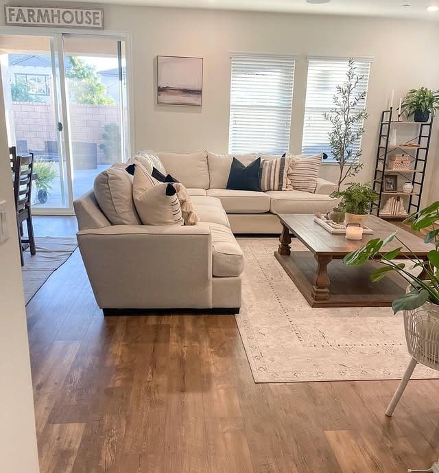 14. Organic Warmth with Classic Farmhouse Charm - modern farmhouse living room ideas