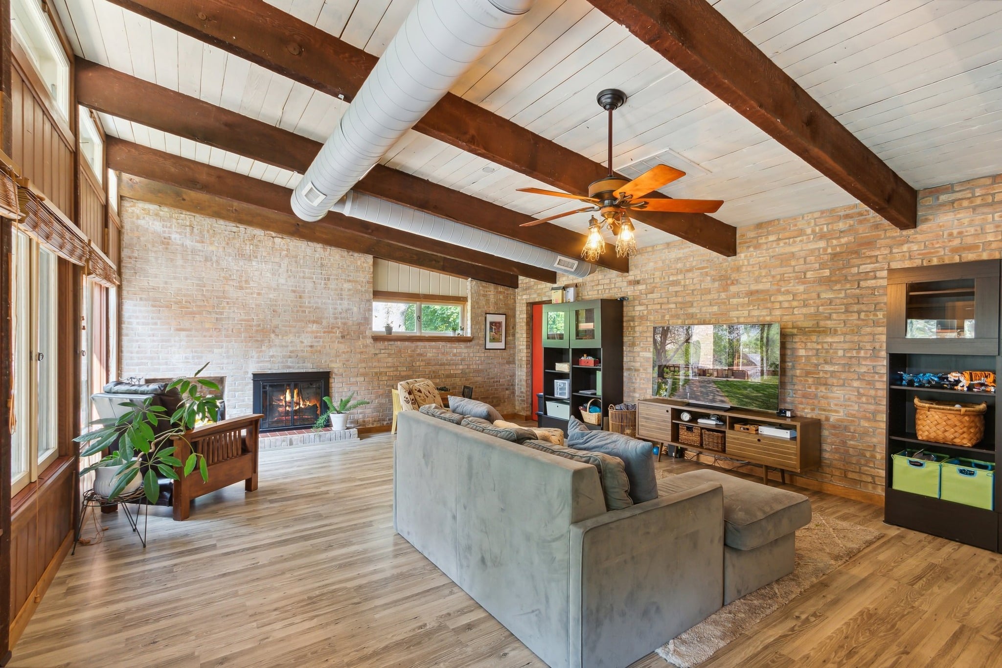 1. Warm Brick Haven with Rustic Timber Charm - industrial living room ideas