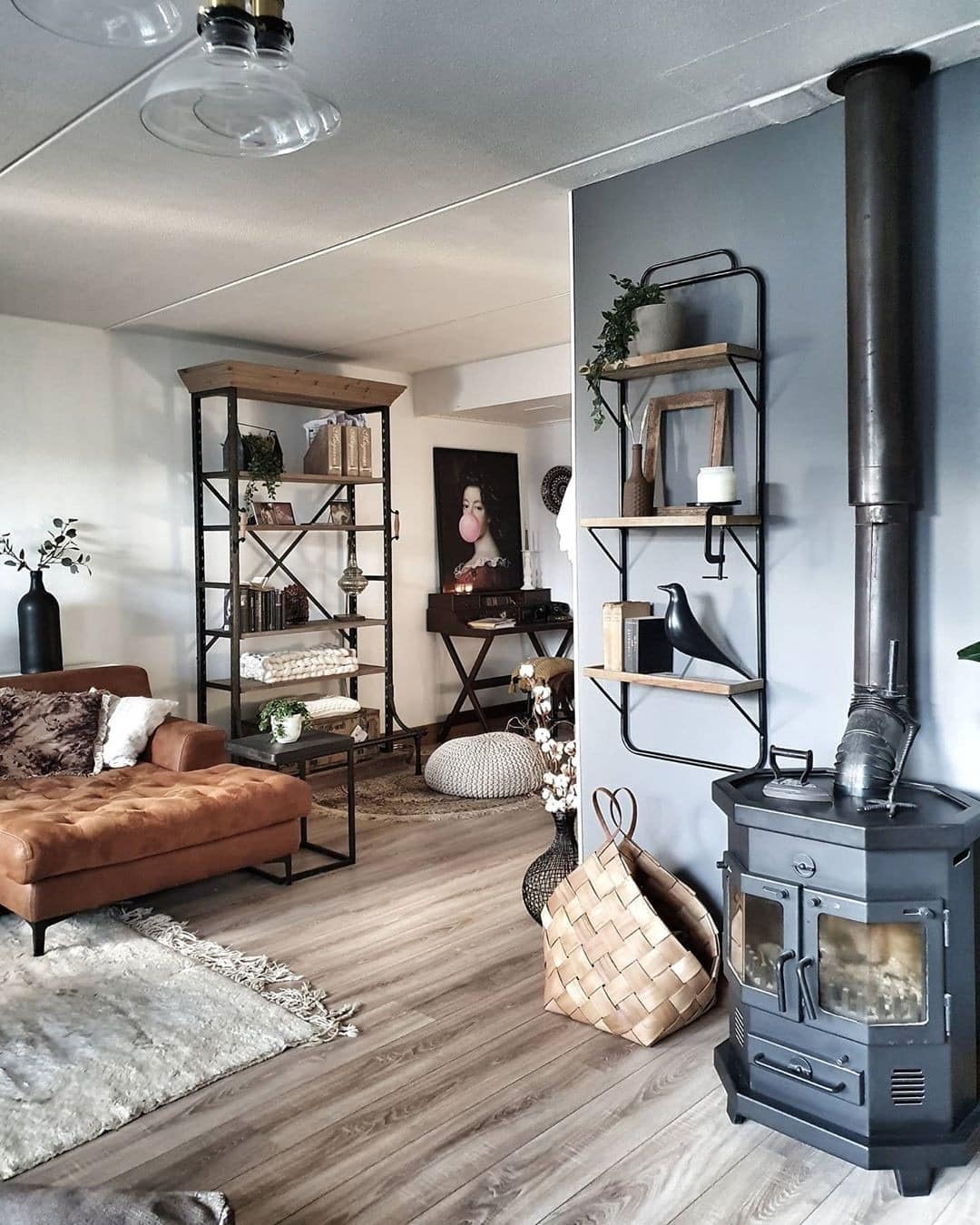 21. Industrial Comfort with Warm Leather and Charcoal Accents - industrial living room ideas