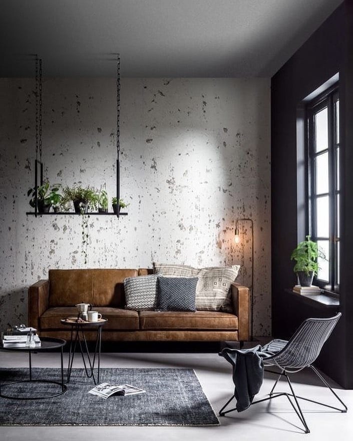 22. Modern Loft Minimalism with Textured Concrete and Cognac Leather - industrial living room ideas