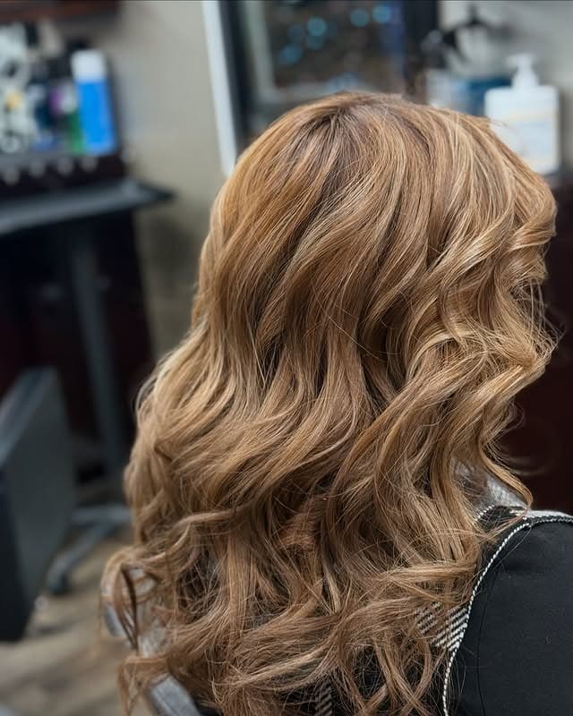 8. Caramel Blonde Curls with Glossy Texture - Honey Blonde Hair with Highlights