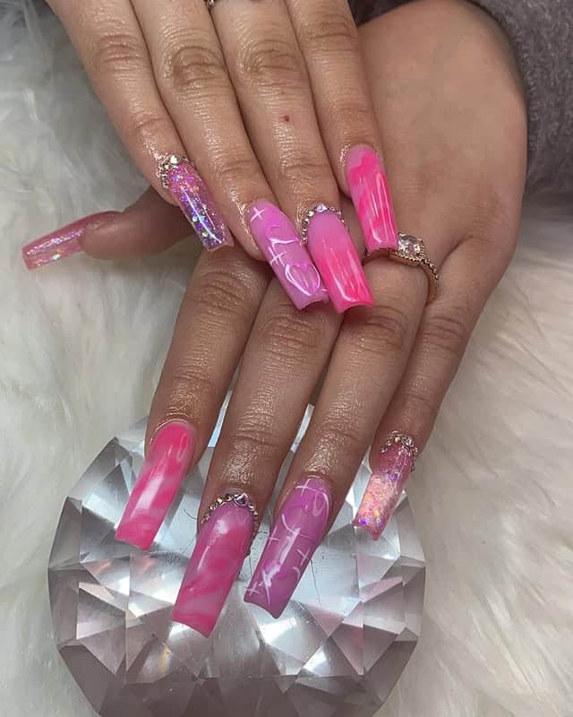 2. Electric Pink Coffin Nails with Glitter and Chrome Accents - pink valentine nail ideas