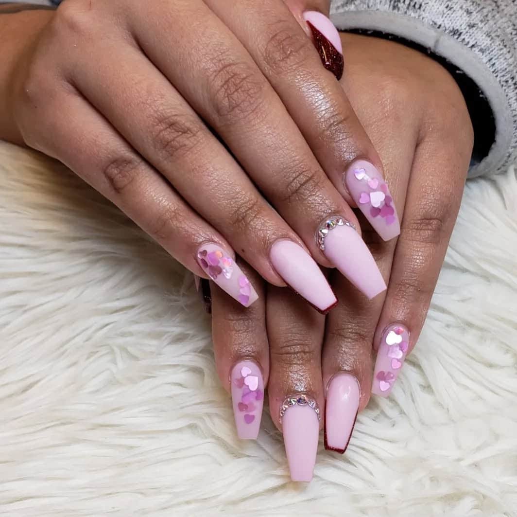 4. Matte Blush Coffin Nails with Heart Confetti and Crystals - pink valentine nail ideas