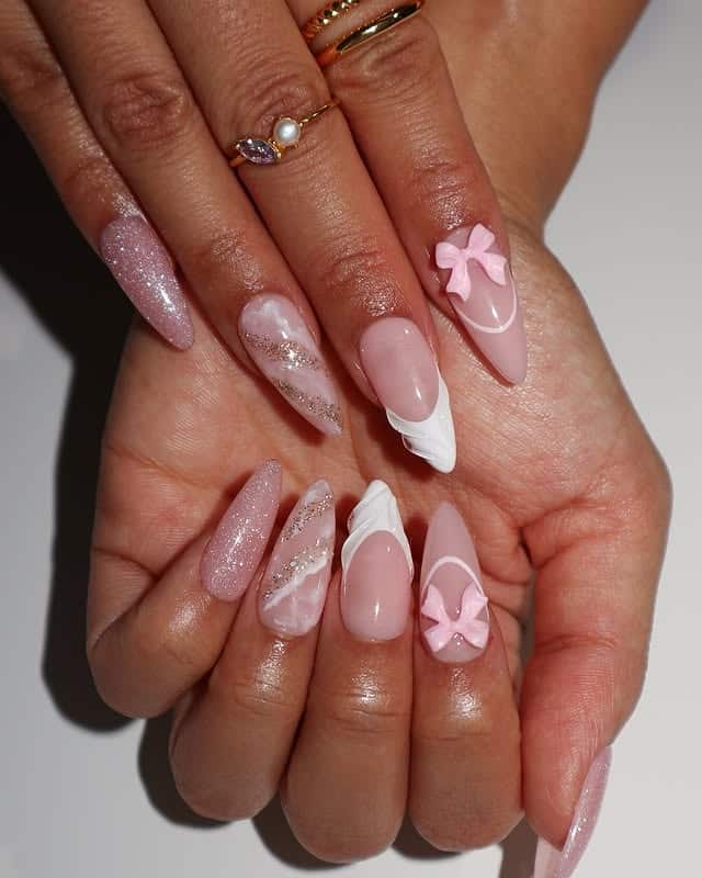 7. Elegant Pink Almond Nails with 3D Bows and Glitter - pink valentine nail ideas