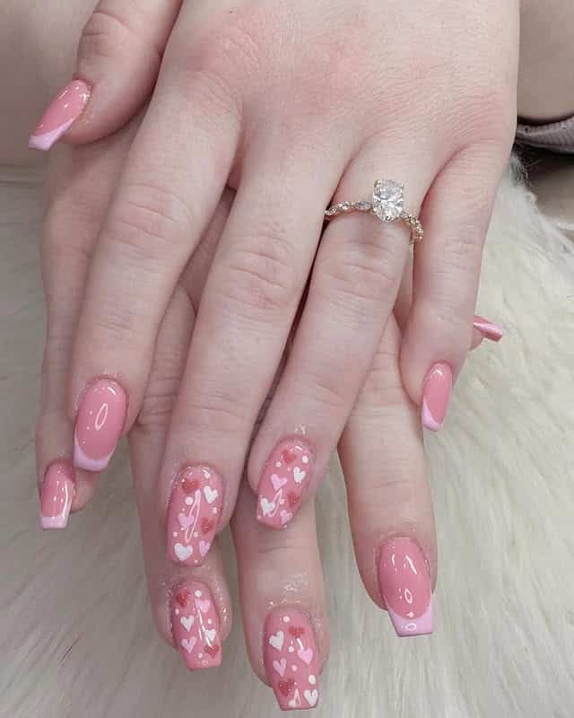 8. Glossy Pink French Nails with Heart Clusters - pink valentine nail ideas