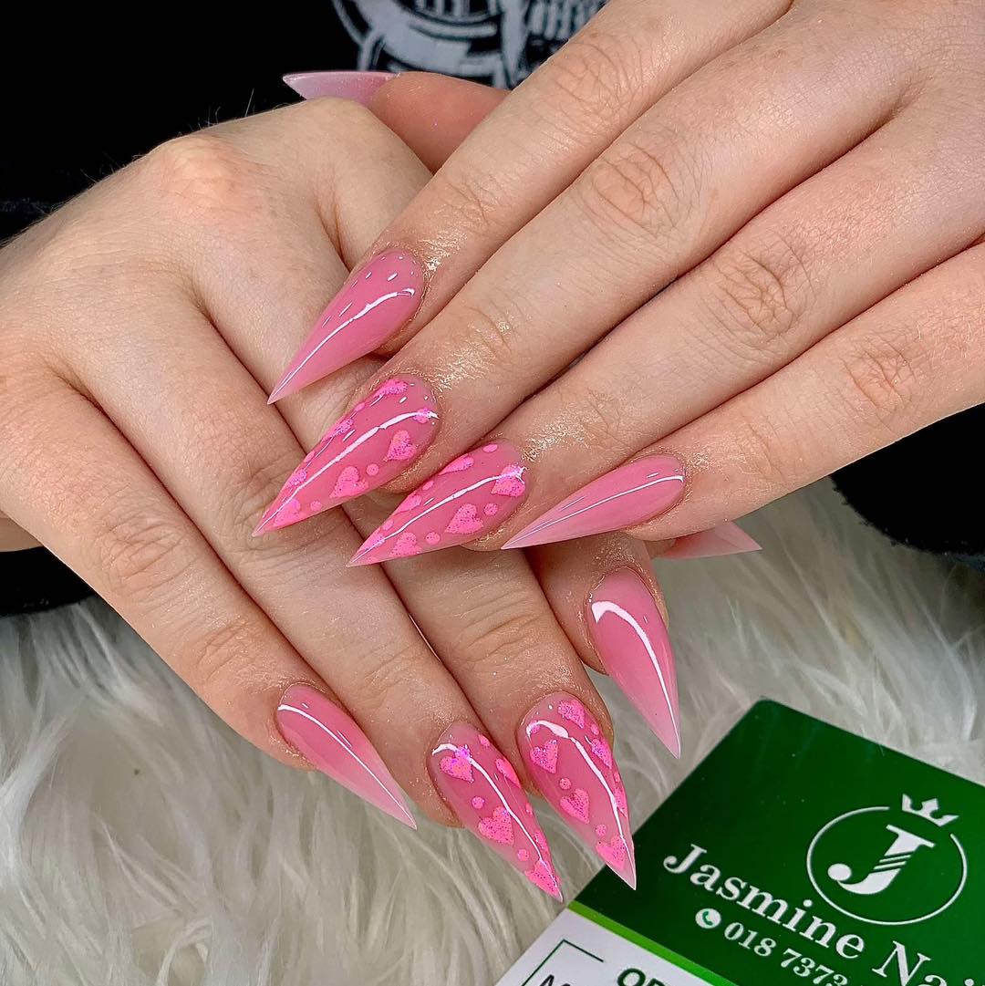 9. Pointed Pink Nails with Heart Foil Accents - pink valentine nail ideas