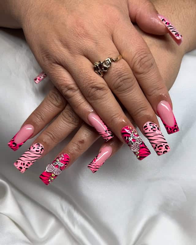 10. Pink Animal Print Nails with Rhinestone Bow Accents - pink valentine nail ideas