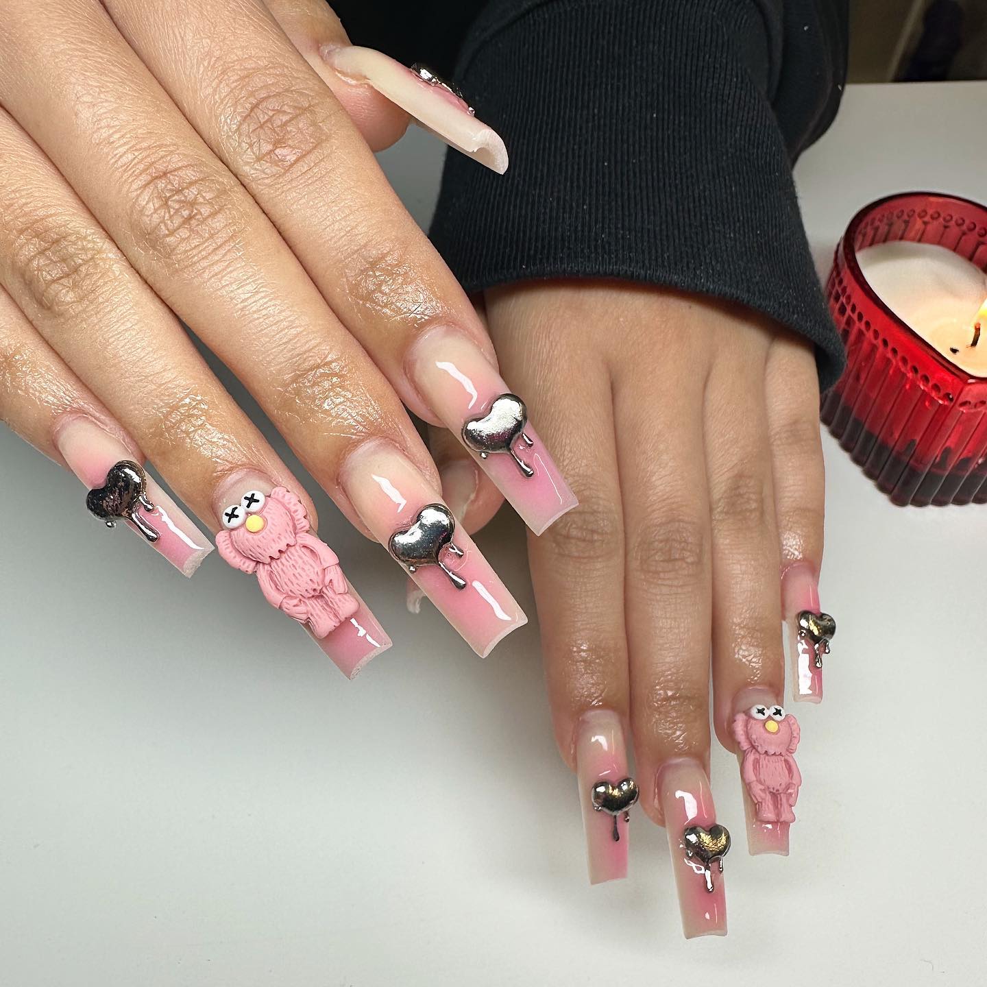 12. 3D Pink and Chrome Heart Nails with Character Accents - pink valentine nail ideas