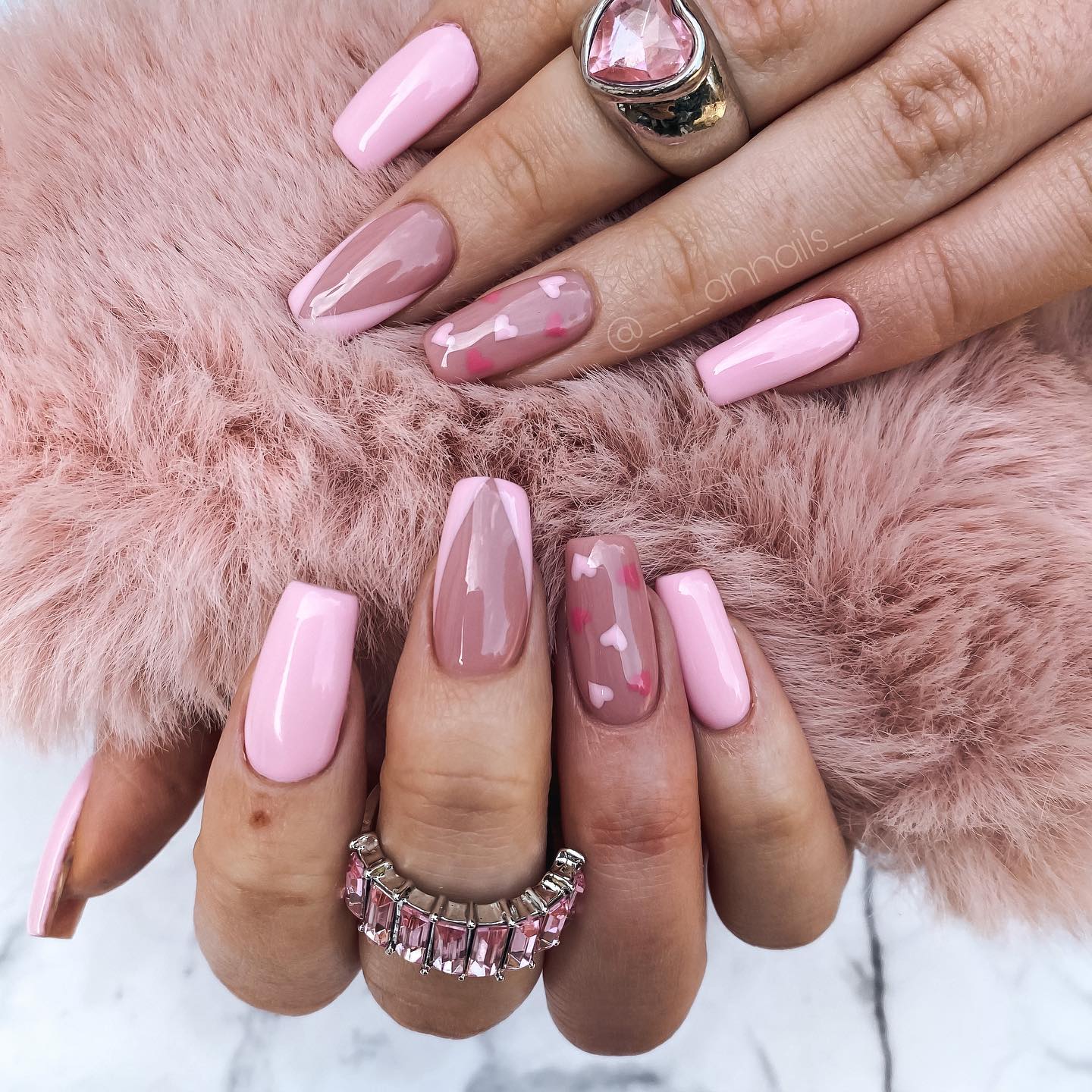 20. Glossy Pink and Nude Nails with Subtle Heart Accents - pink valentine nail ideas