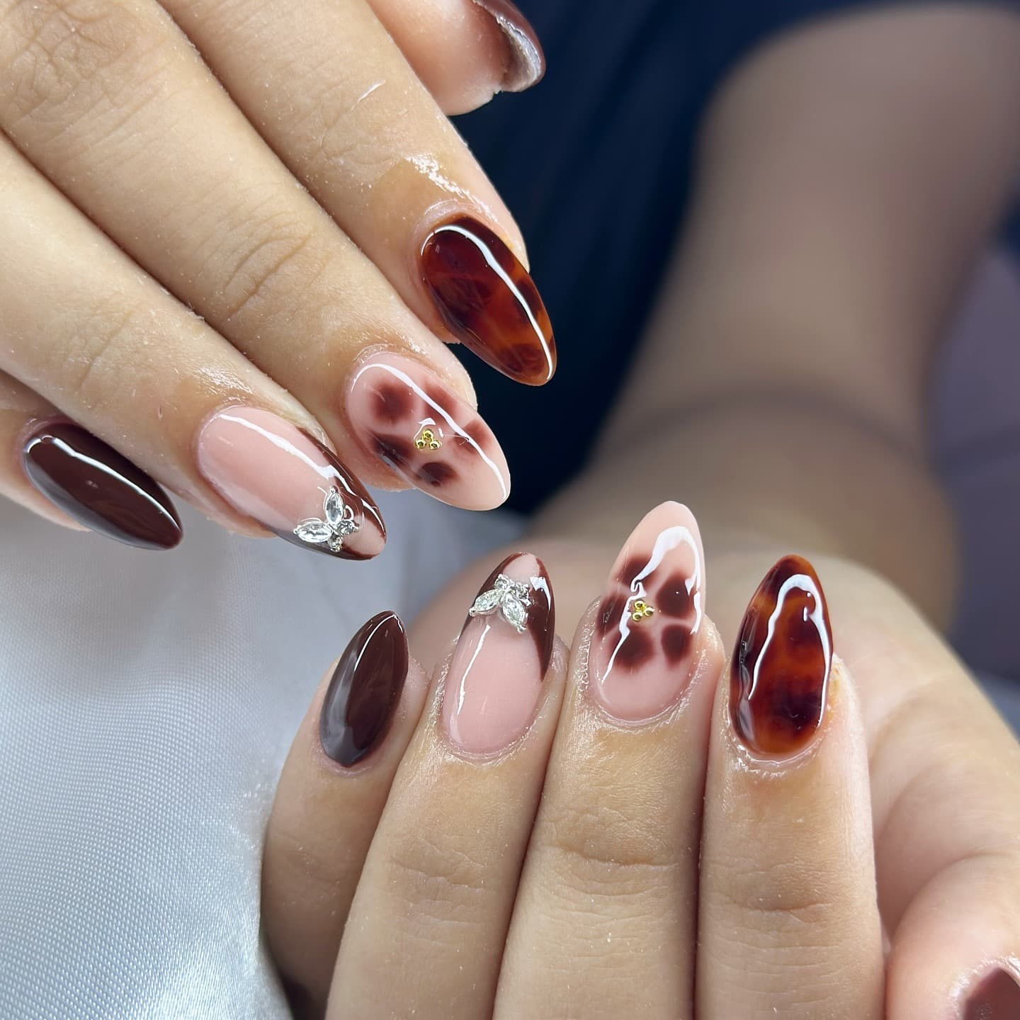 14. Tortoiseshell Plum Fusion - plum nail ideas