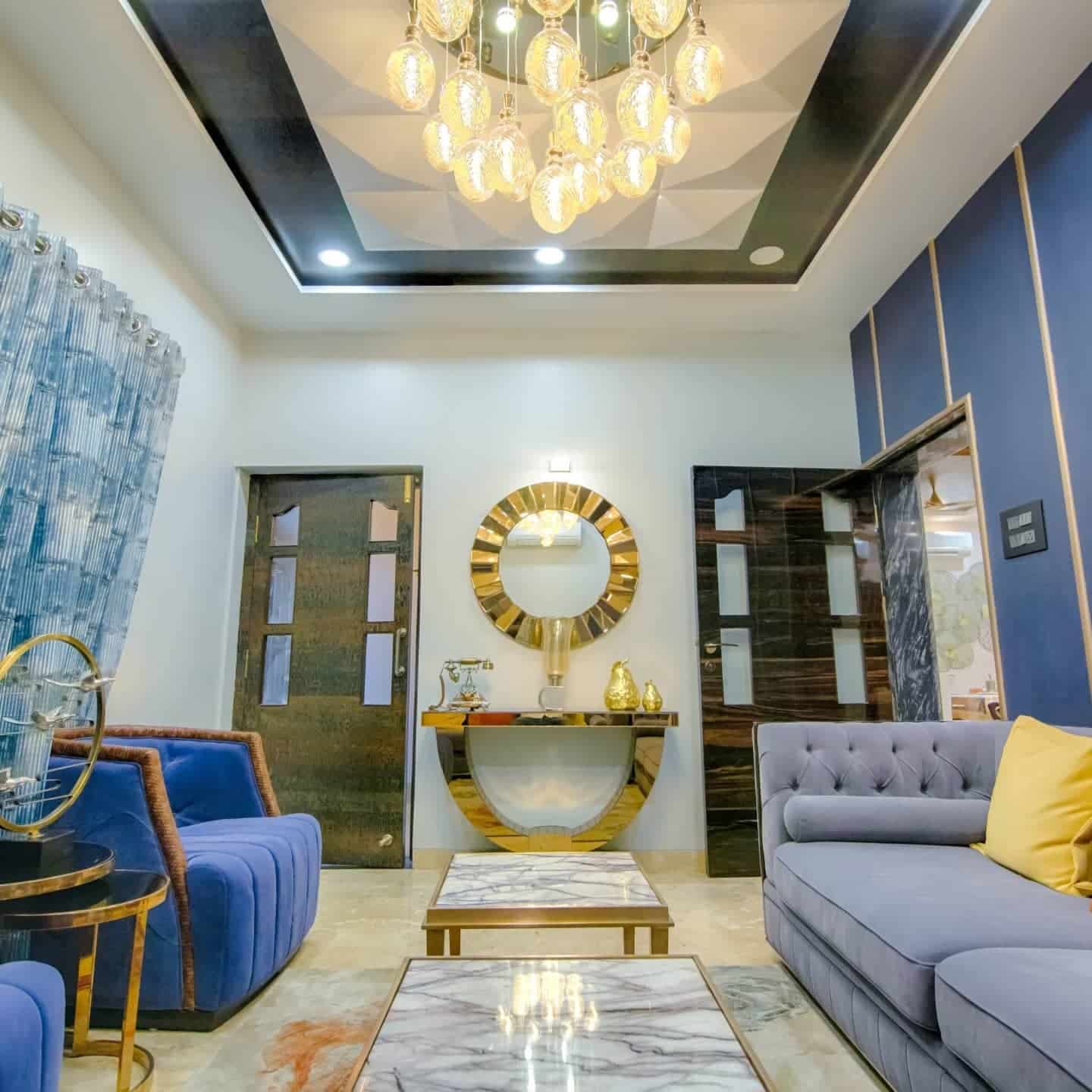 3. Luxe Contrast with Gold Accents - grey and blue living room ideas