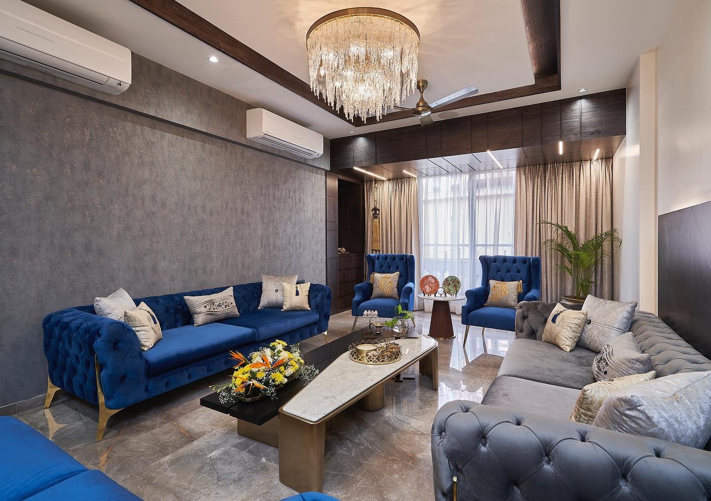 9. Polished Comfort with Blue Velvet Touches - grey and blue living room ideas