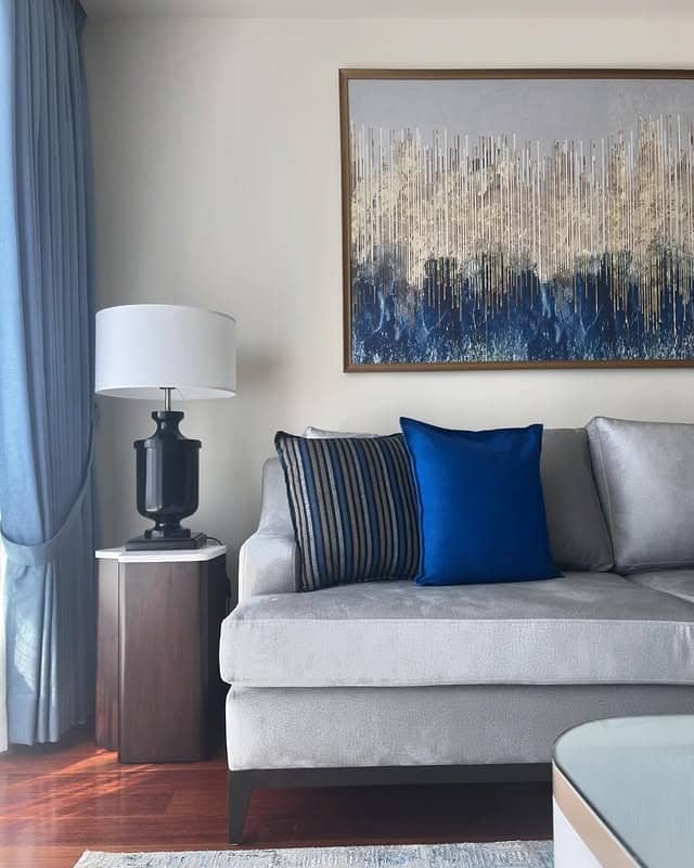 21. Elegant Simplicity in Sky Blue and Silver Grey - grey and blue living room ideas