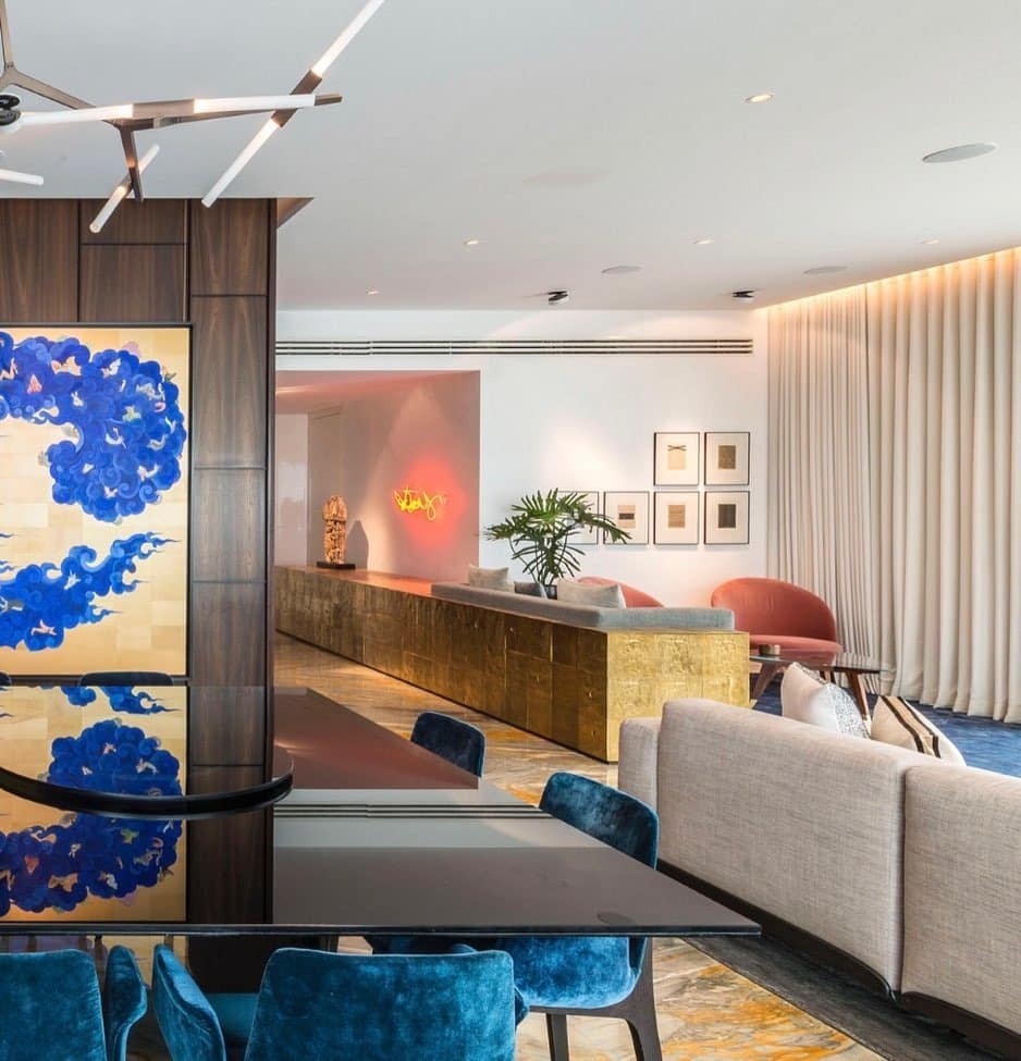 8. Artful Contrast with Modern Blue Tones - teal and grey living room ideas