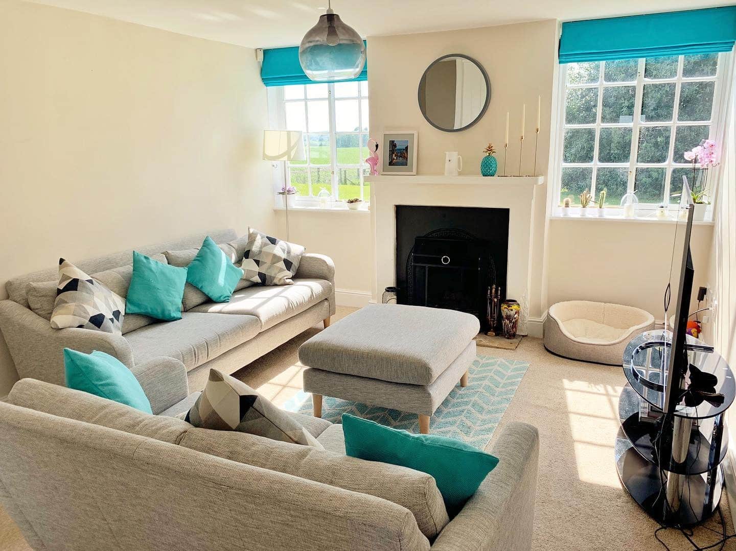 13. Airy Comfort with Teal Touches - teal and grey living room ideas