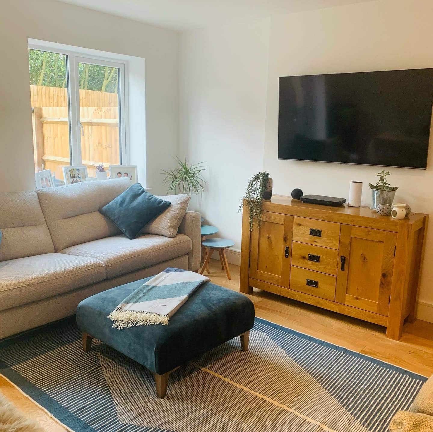 14. Modern Simplicity with Teal Accents - teal and grey living room ideas