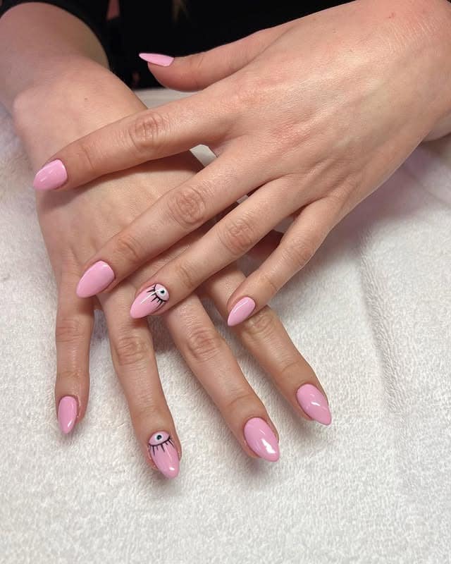 4. Soft Pink Evil Eye Nails - pointed nail ideas