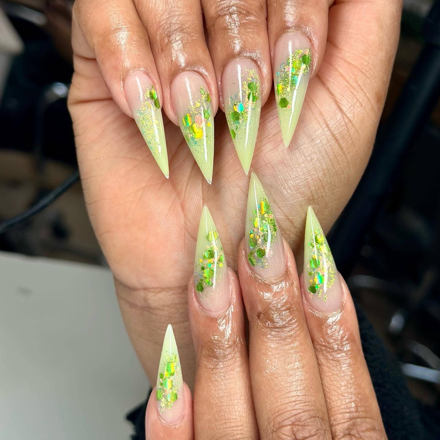 7. Neon Lime Glitter Burst - pointed nail ideas