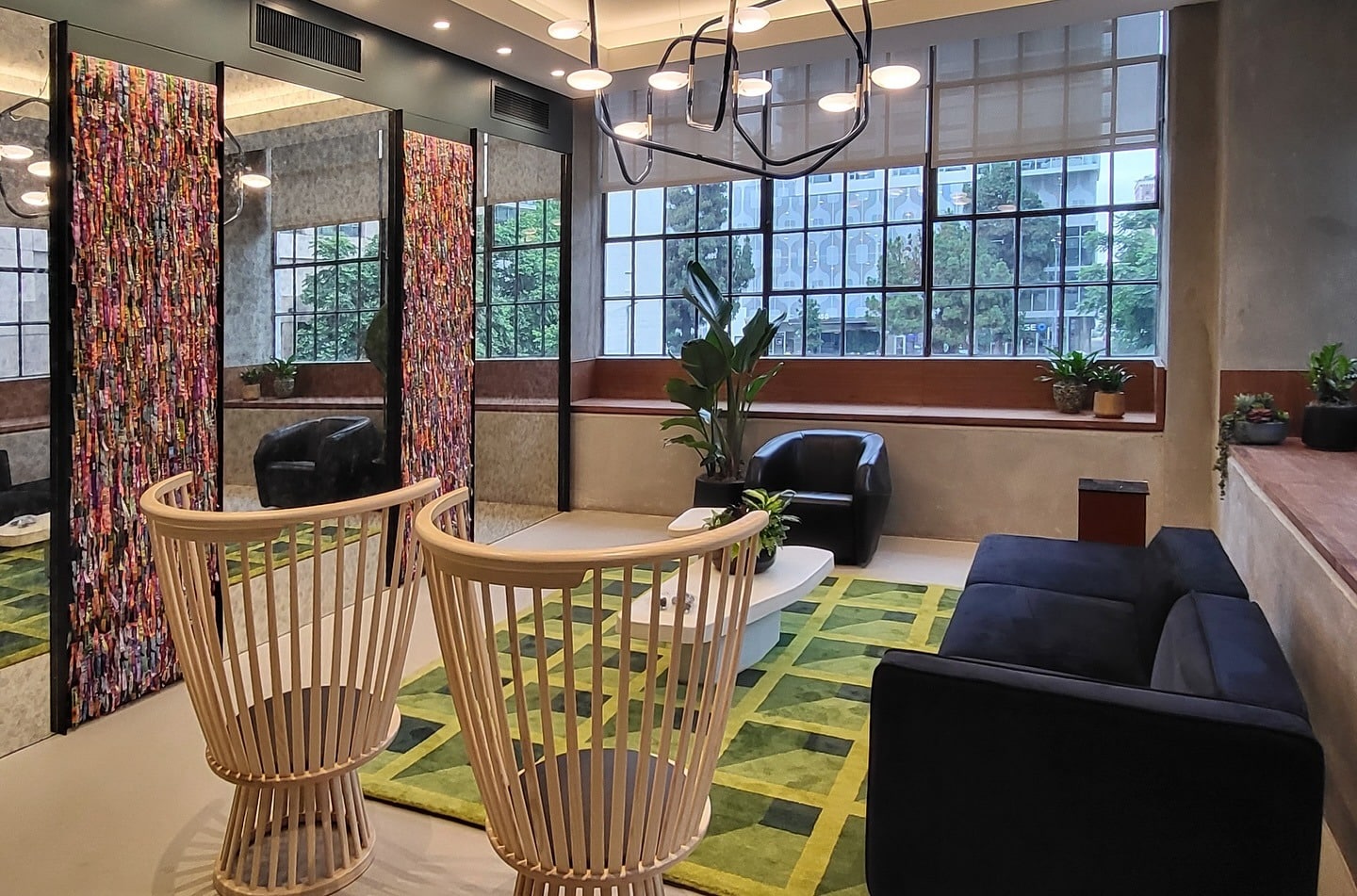 11. Art-Inspired Lounge with Citrus Accents - corporate office ideas