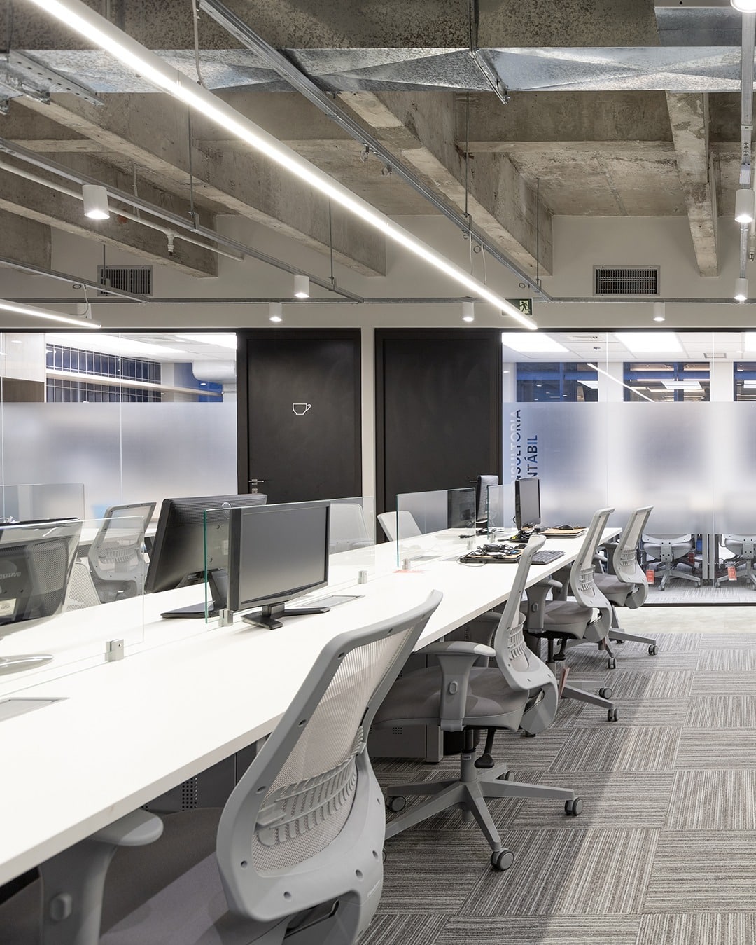 16. Contemporary Open Workspace in Gray Tones - corporate office ideas