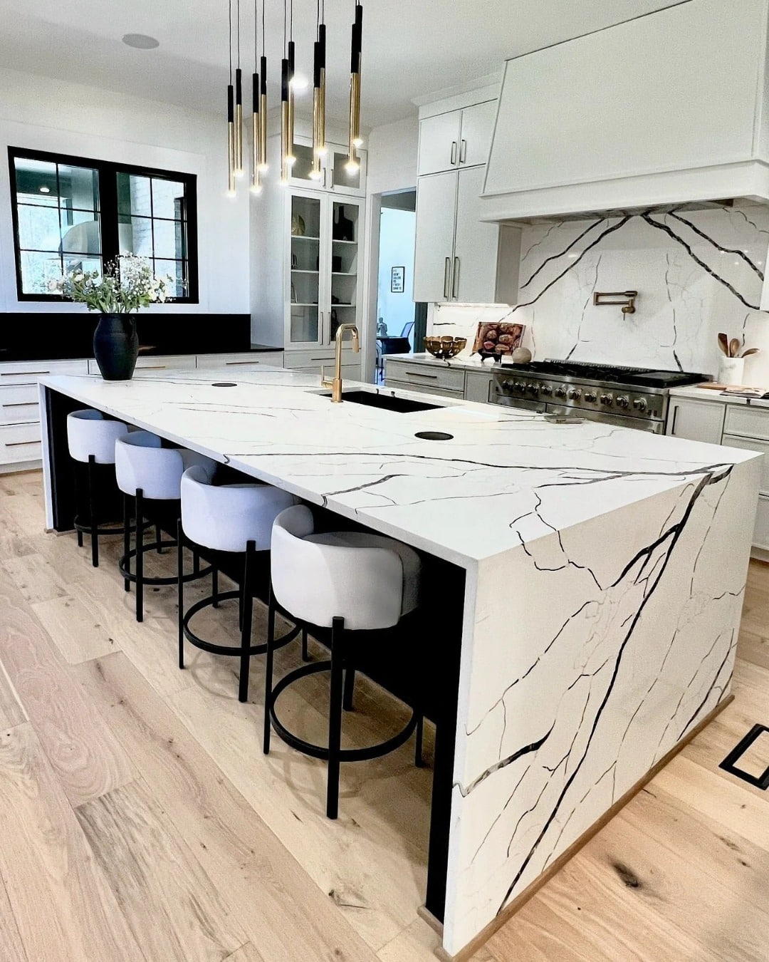 20. Sculpted Marble and Matte Gold Balance - kitchen centerpiece ideas