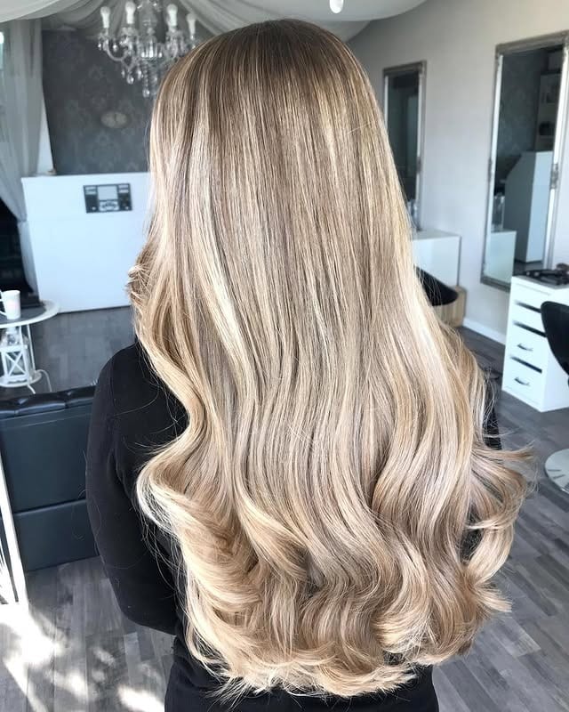 8. Creamy Caramel Blonde Waves - Long Blonde Hair