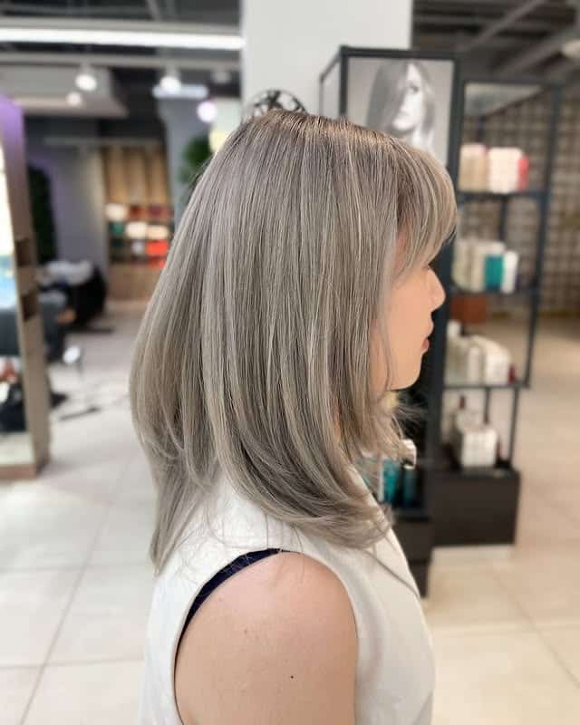 6. Icy Ash Silver Lob with Wispy Layers - Ash Blonde Balayage
