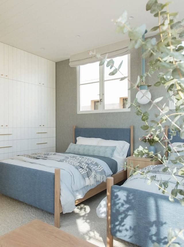 6. Scandinavian Simplicity with Gentle Blue Accents - gray and blue bedroom ideas
